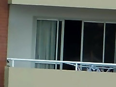 voyeur girl garnni bbw in balcony argentina . far away 200 m
