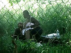 Voyeur tapes a black gamna tv couple having masseg sxs on bench in the park