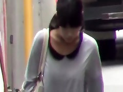 Japanese women pissing beyond a building