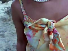 A hot mature shows us her naked body in the field A hot mature shows us her naked body in the field