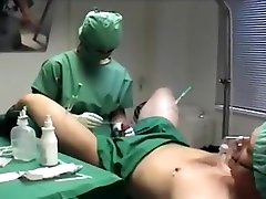 Penis needling in big plug in the ass