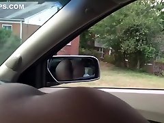 Black slut sucking dick in car. View of ass.