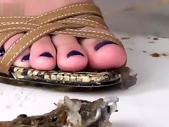 Vika crushing snails in heels.