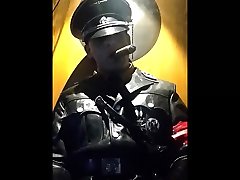 leather uniform officer smoking a cigar