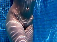 Big tits Sheril goes underwater naked