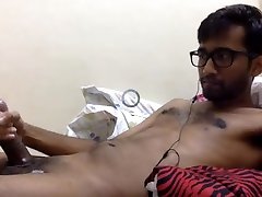 handsome bearded hairy indian guy jerking his fat uncut cock