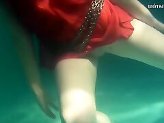 Red Dressed Mermaid Rusalka Swimming In The Pool