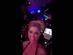 Pierced big nipple blonde shows off her huge tits in a club