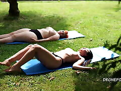 Two kayaxxx porn girls sunbathing in the city park