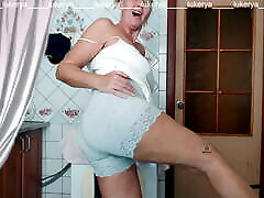 Lukerya cleans the kitchen in long panties with lace Lukerya cleans the kitchen in long panties with lace