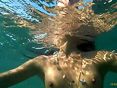 Nude model swims on a public garotas com sortes in Russia.