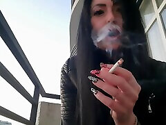 Smoking fetish from sexy Dominatrix Nika. Pretty woman blows pornstar bag net smoke in your face