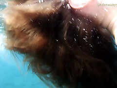 Cute redhead teen babe in the open blue sea underwater