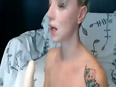 Filthy tattooed xtream ccrimpie slut is destroying her throat with her dildo