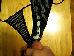 Jerking off and cumming on my wifes tiny black thongs
