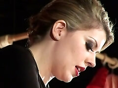 Awesome ash-blonde dominatrix spanking her thrall