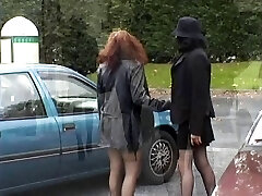 Two babes flashing their boobies and pussy in public place