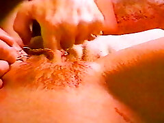 A one of a kind pierced babe sizzling her pussy lips opened up