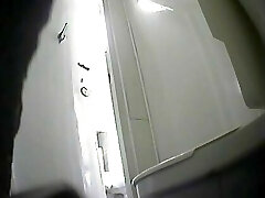 Girls peeing in a rest room-2