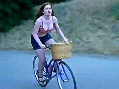 Annalise Basso railing a bike