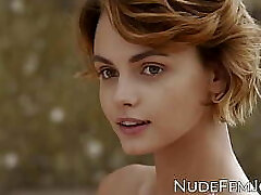 Gorgeous redhead teases with her natural jugs and soft pussy