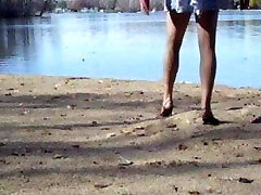 Crossdresser at the lake in hose and heels