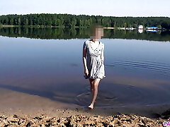 Nudist Girl Heads Skinny Dipping in a Beach