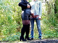MILF in leather micro-skirt gets a load on her butt outdoors
