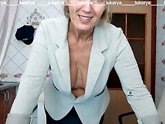 Lukerya tries on a jacket to a skirt, flashes bare boobs