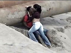 Latino pair caught on the beach