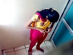 Some amateur Indian brunette gals peeing in the restroom on voyeur cam