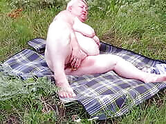 fat girl masturbates pussy with toys in nature